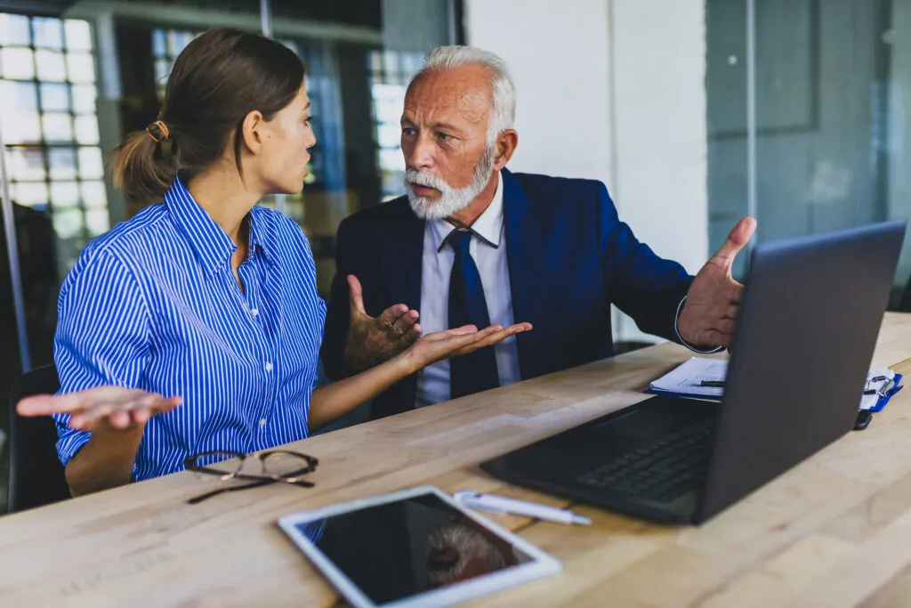 Colleagues arguing at workplace